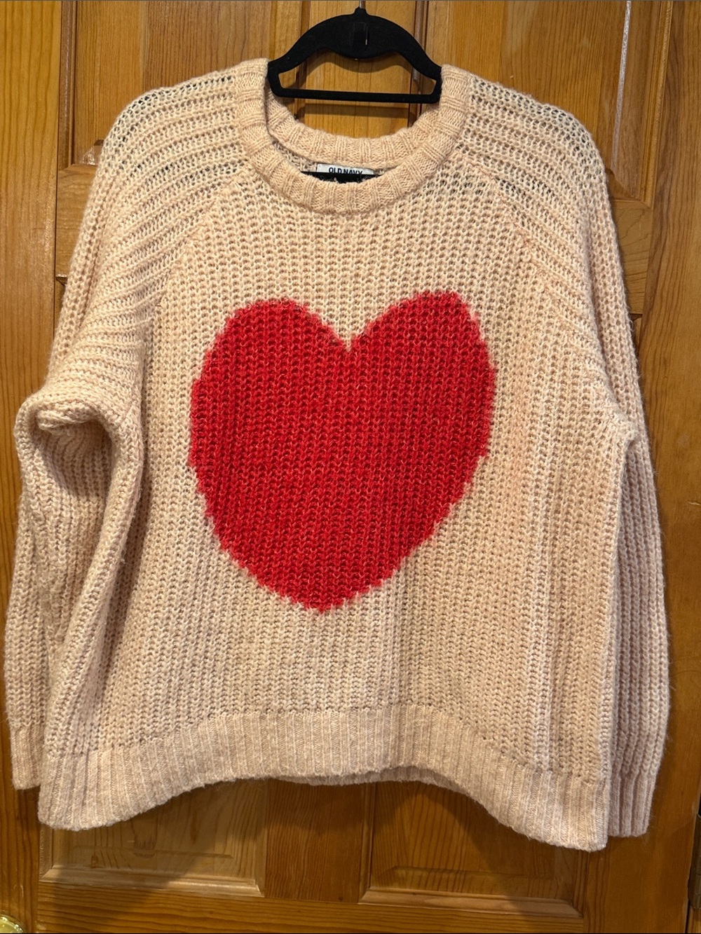 Old Navy women’s pink sweater with heart size medium.
